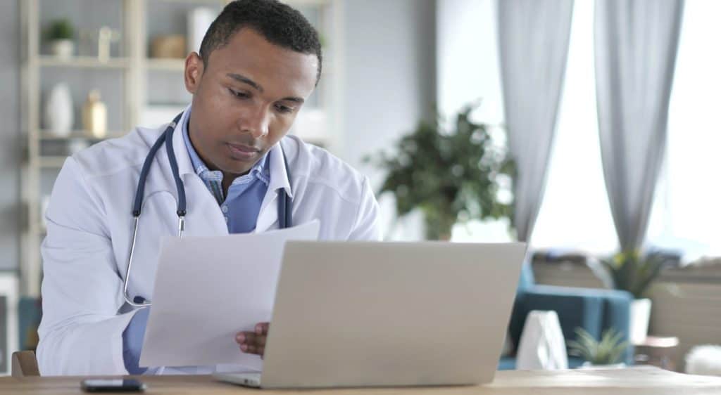 Doctor Reading medical Report, Diagnosing Patient