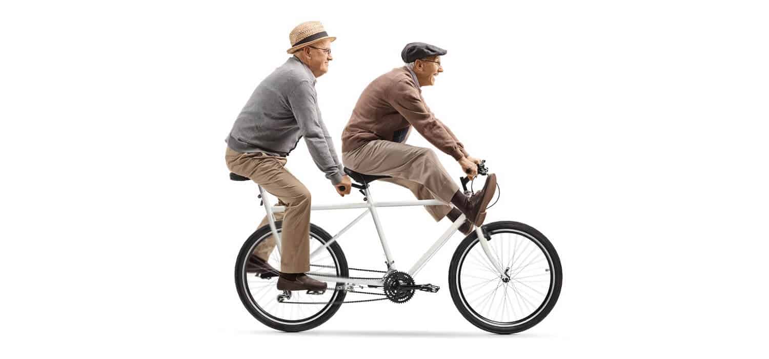 Two men on tandem bike